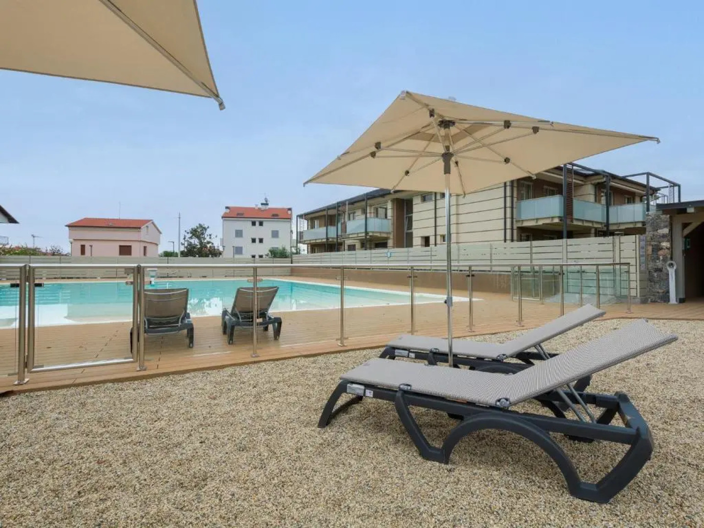 Leonardo - swimming pool and wide patio with barbecue