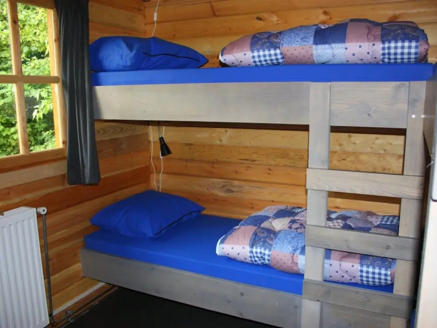 Wooden Cottage With a Veranda Located in a Natural Area