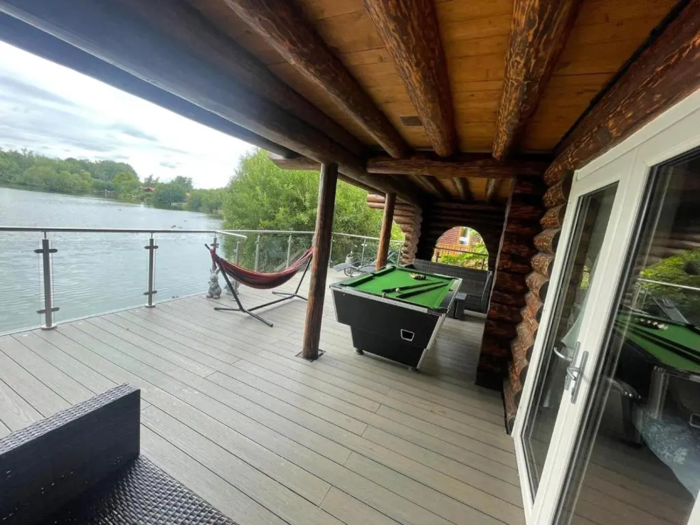 Woodpecker Log Cabin with hot tub, pizza oven bbq entertainment area, lakeside with private fishing peg situated at Tattershall Lakes