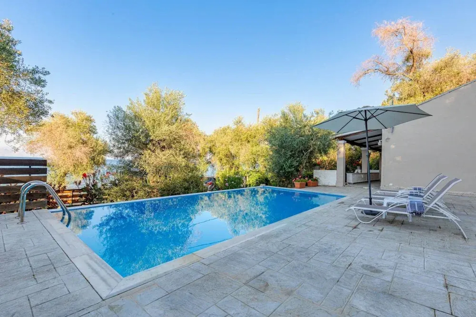 Deja Blue Beach Pool House by Estia