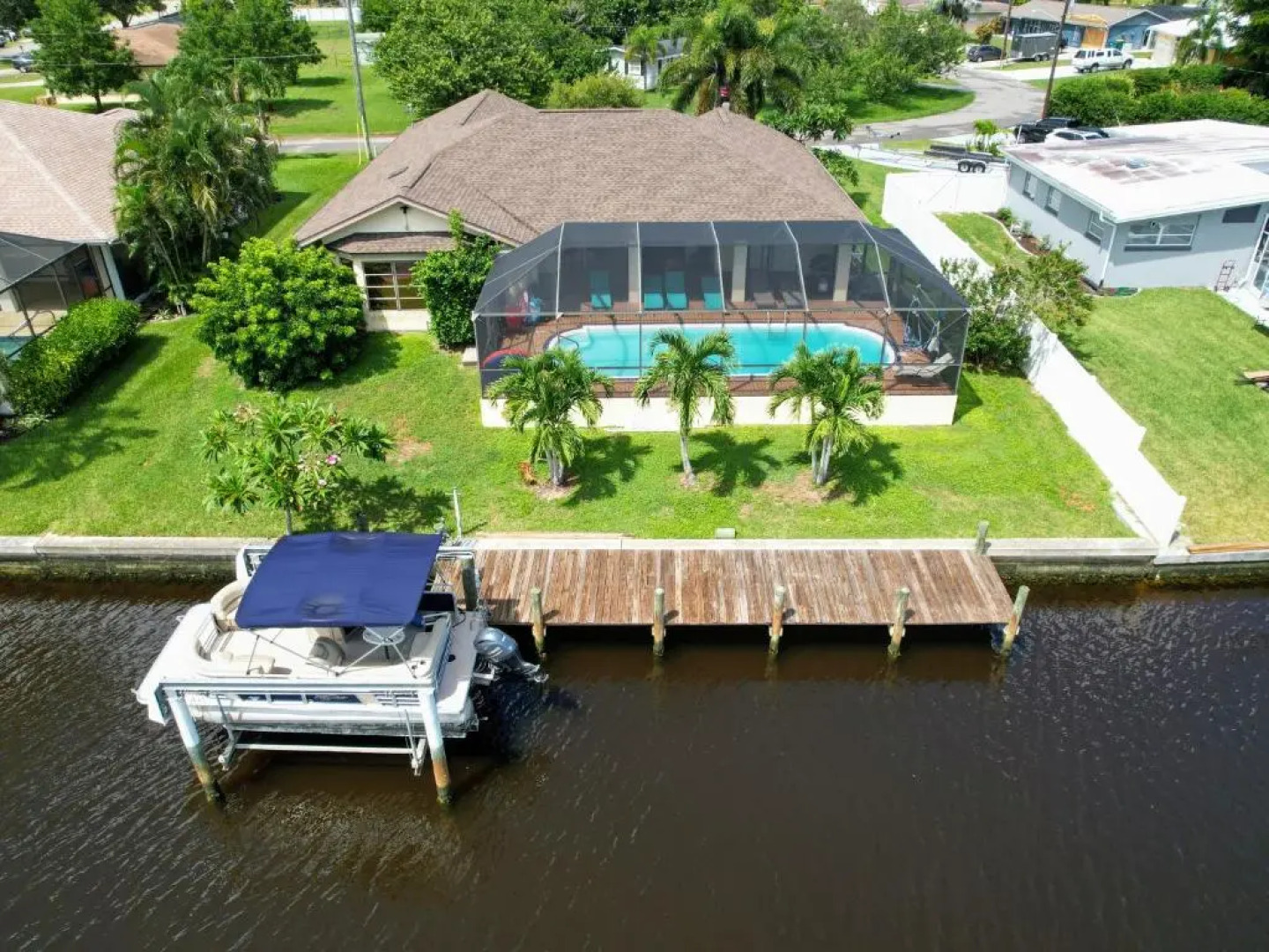Waterfront House with a Boat and Heated Pool