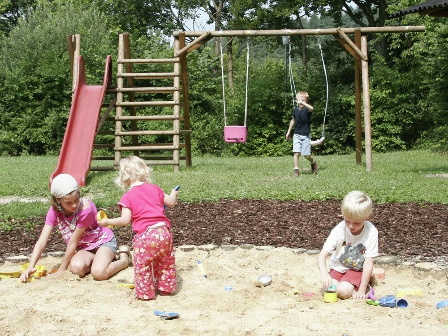 Detached, wooden bungalow with a terrace, in a wooded area