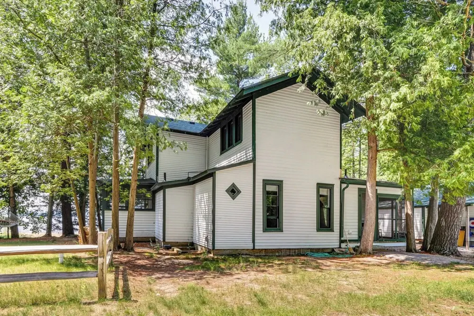 Torch Lake Getaway w/ Private Beach + Boat Dock!
