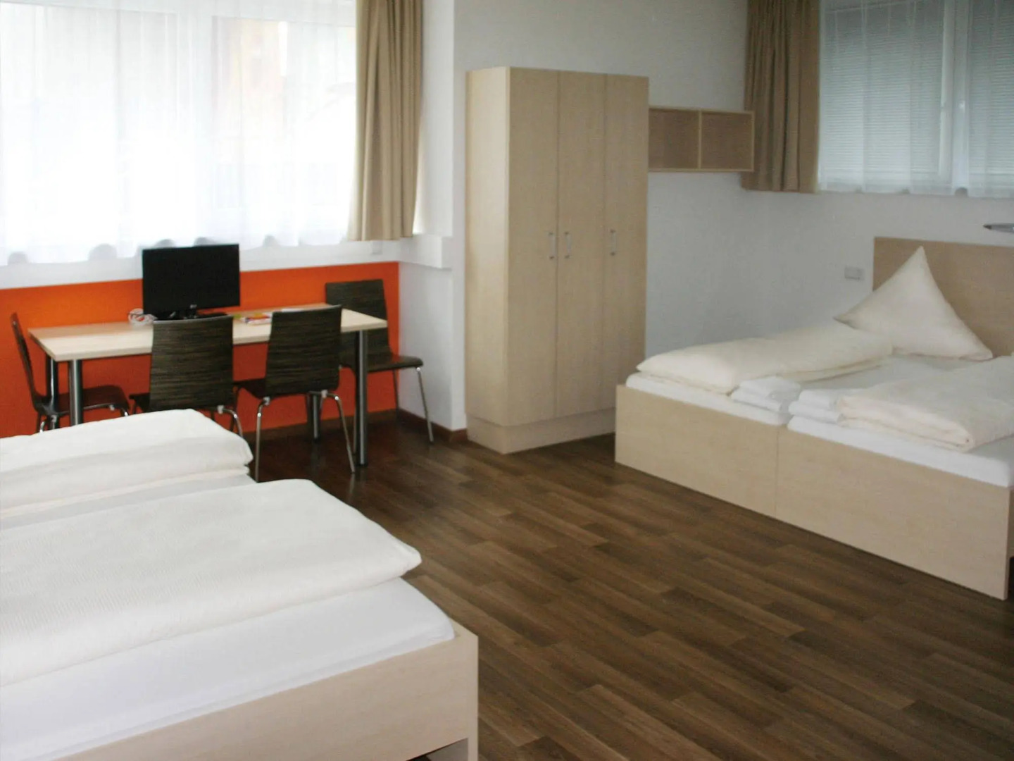 Orange Hotel und Apartments