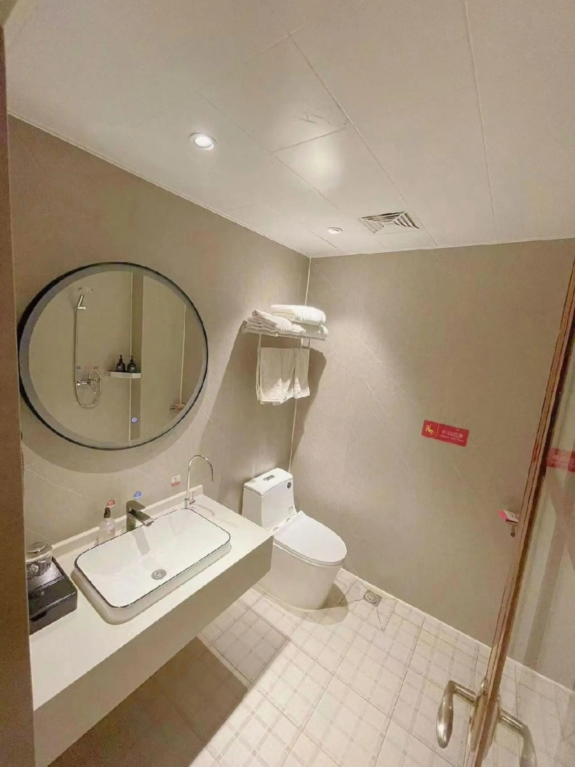 Wanjia Business Hotel (Zaozhuang Maoyuan)