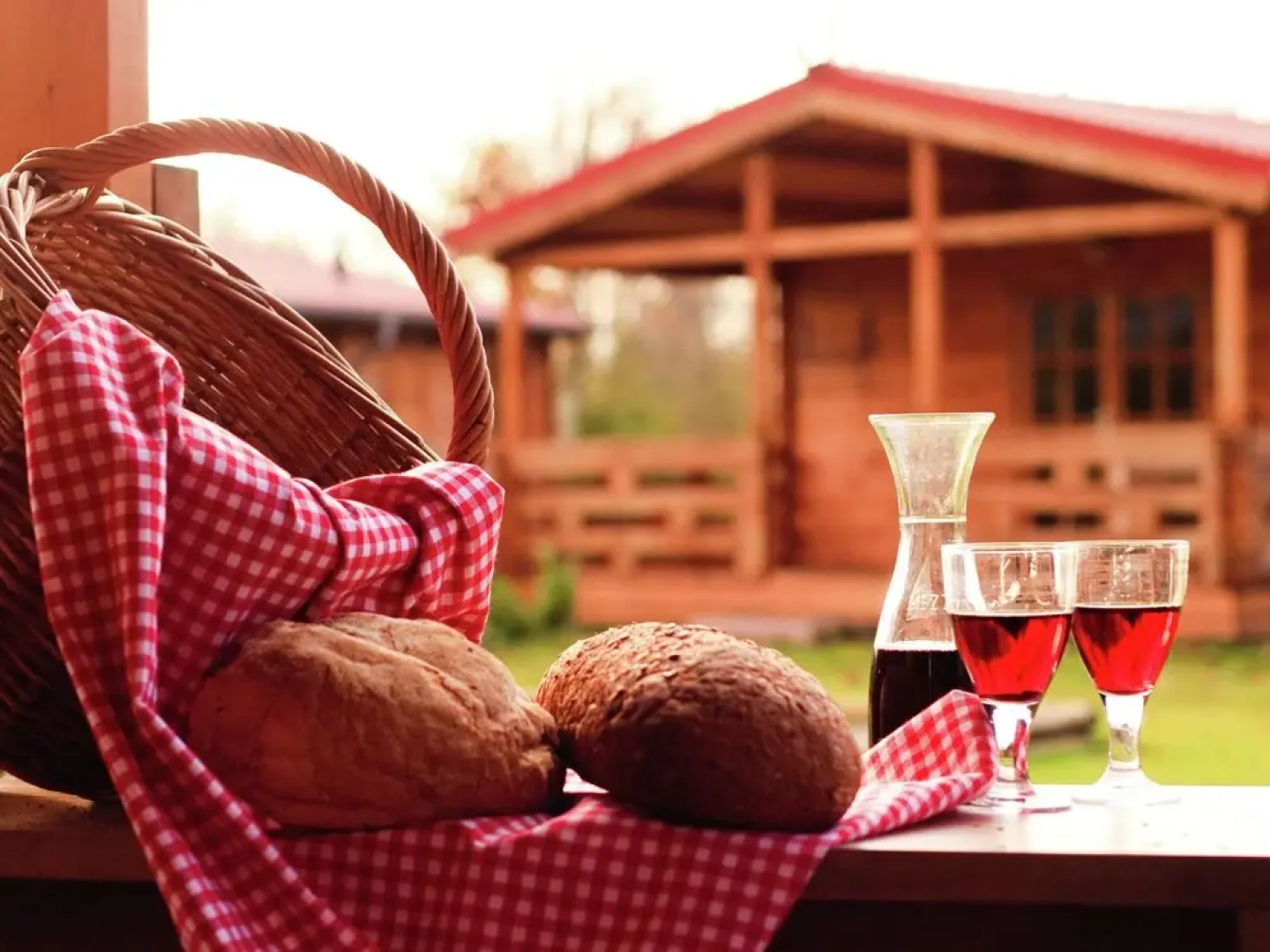 Wooden Cottage With a Veranda Located in a Natural Area