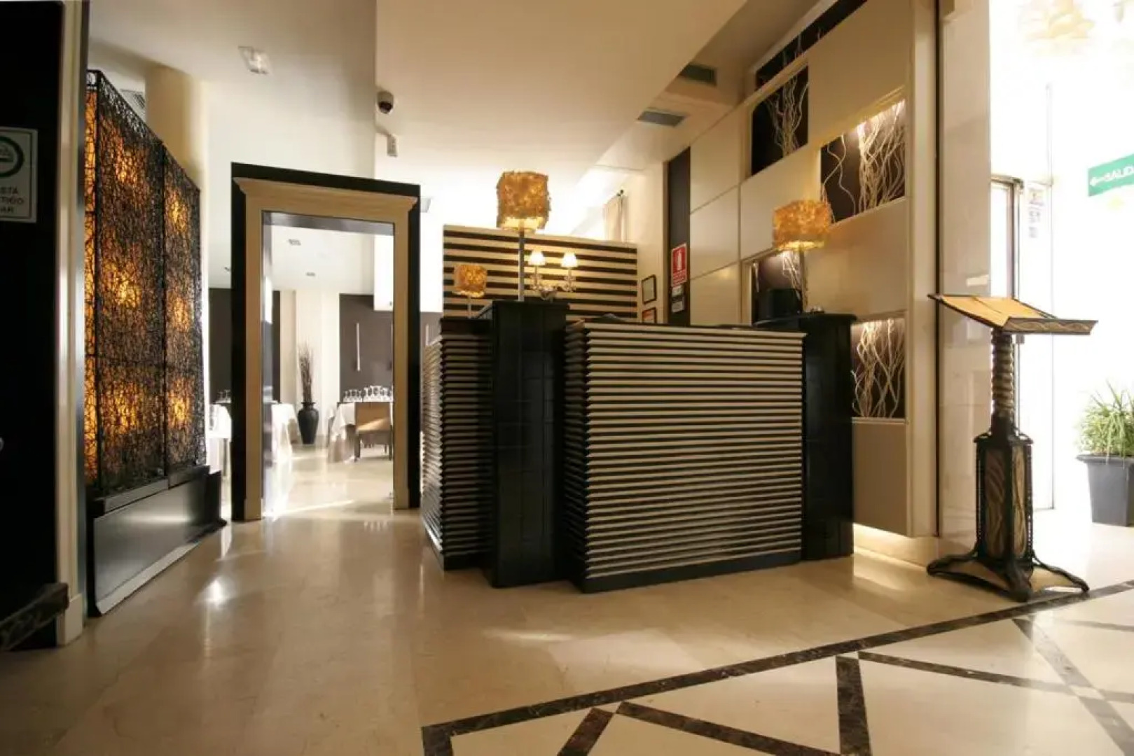 Hotel Asador H.M. Versus