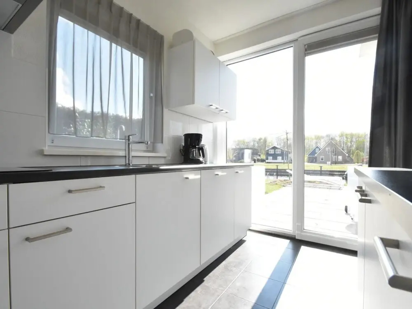 Modern Villa with Large Garden by the Water with Hot Tub & Infrared Sauna