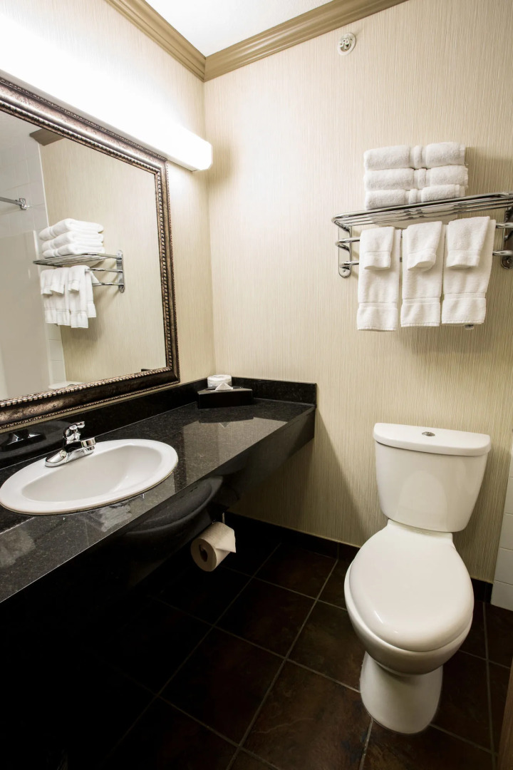 Merit Hotel & Suites