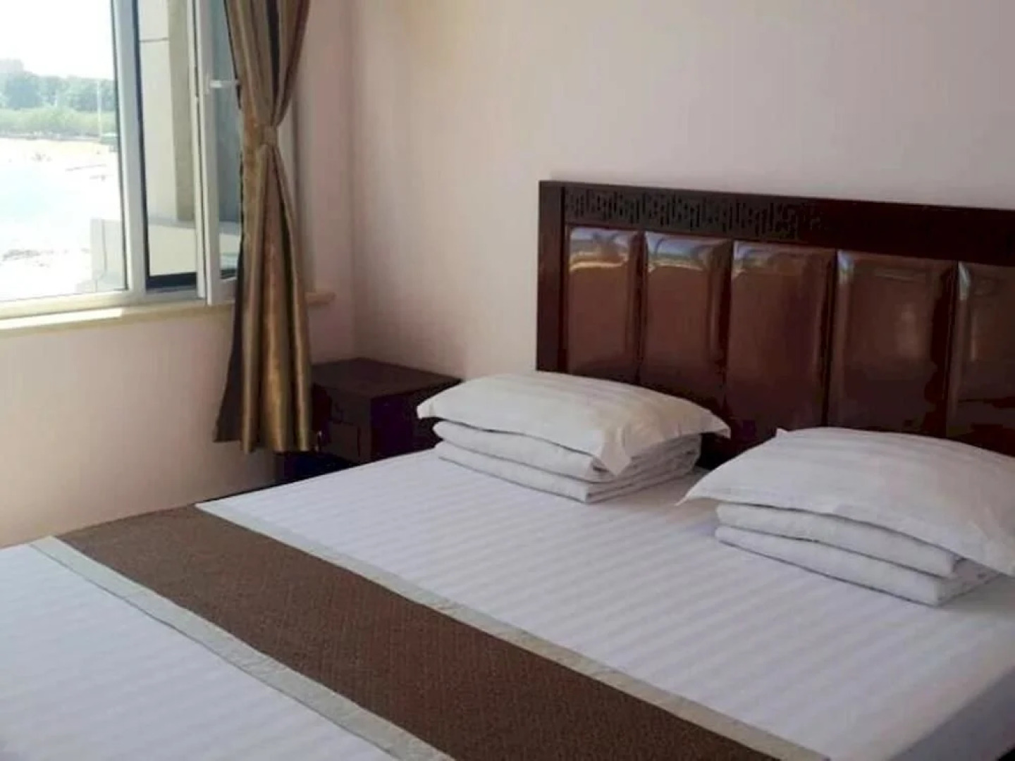 Xingcheng Xiaolonggong Hotel