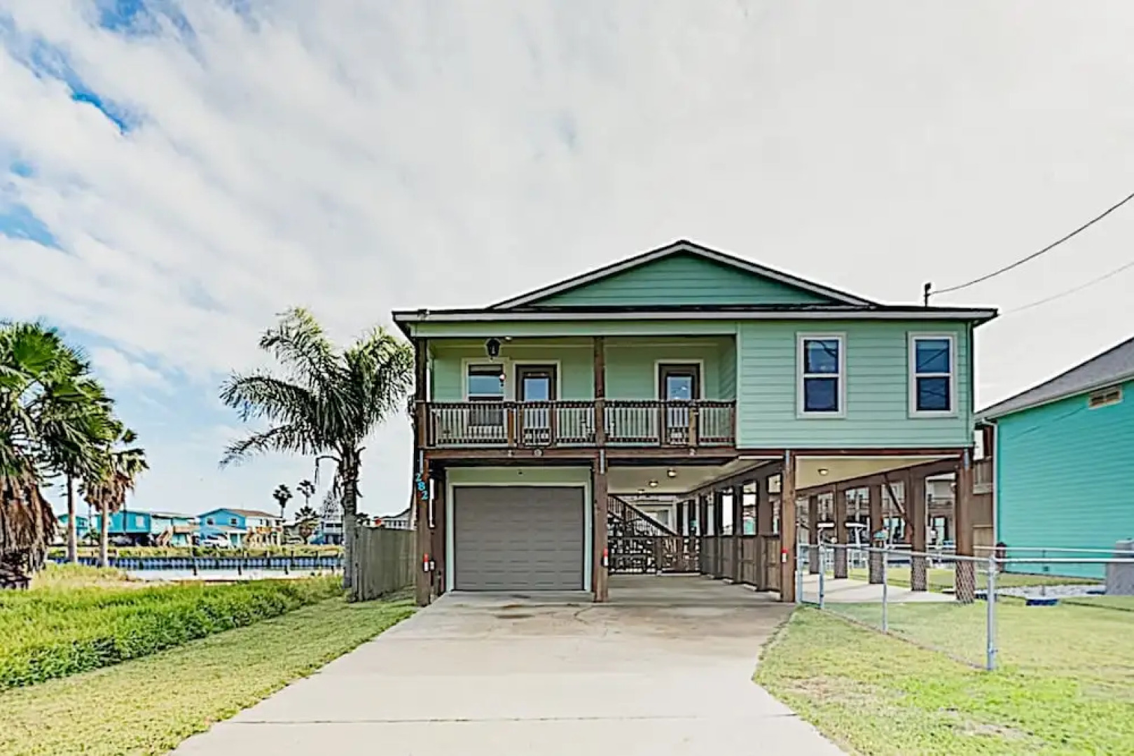 Canal-front Getaway W/ Enclosed Deck & Boat Dock 4 Bedroom Home