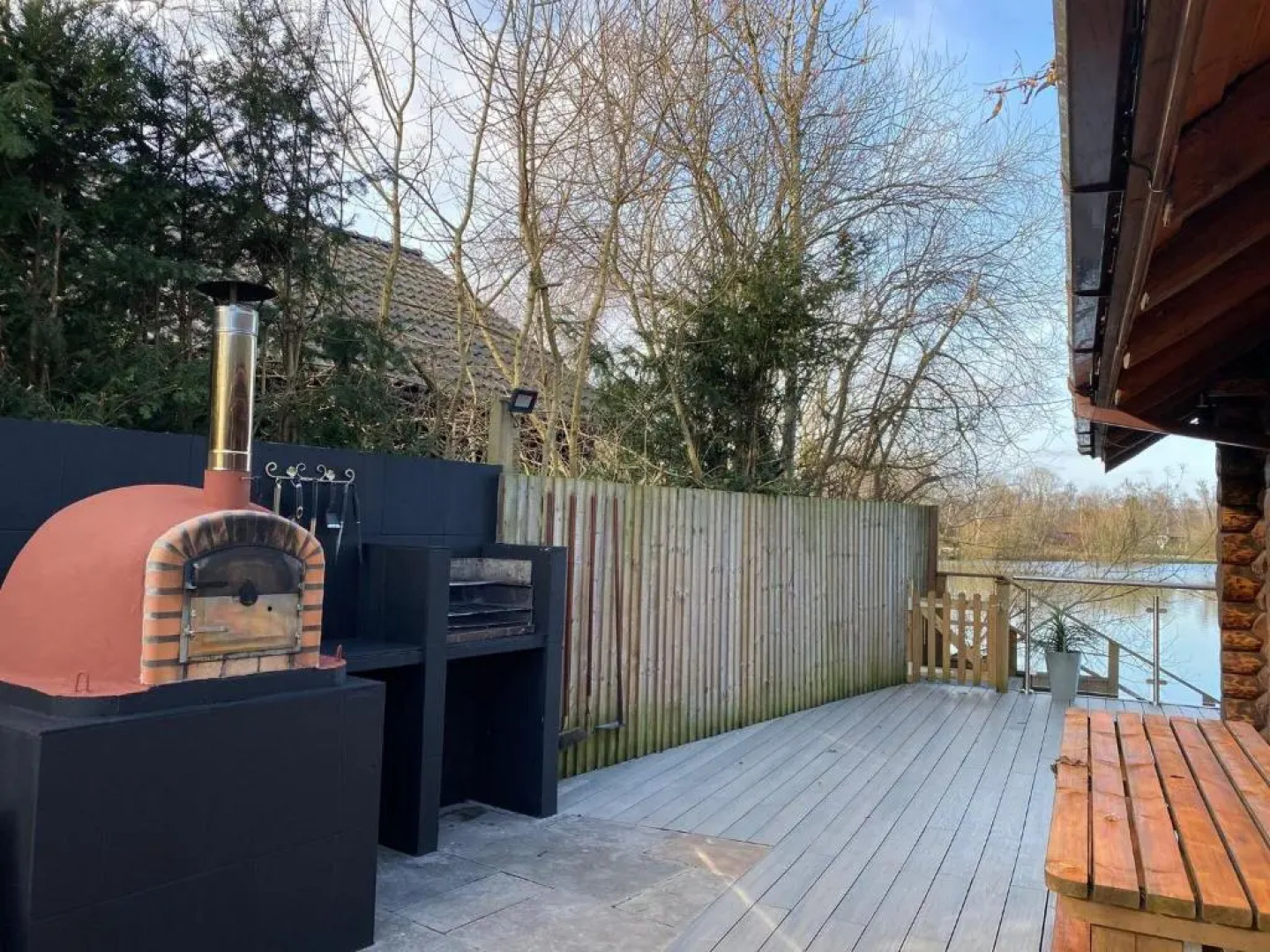 Woodpecker Log Cabin with hot tub, pizza oven bbq entertainment area, lakeside with private fishing peg situated at Tattershall Lakes