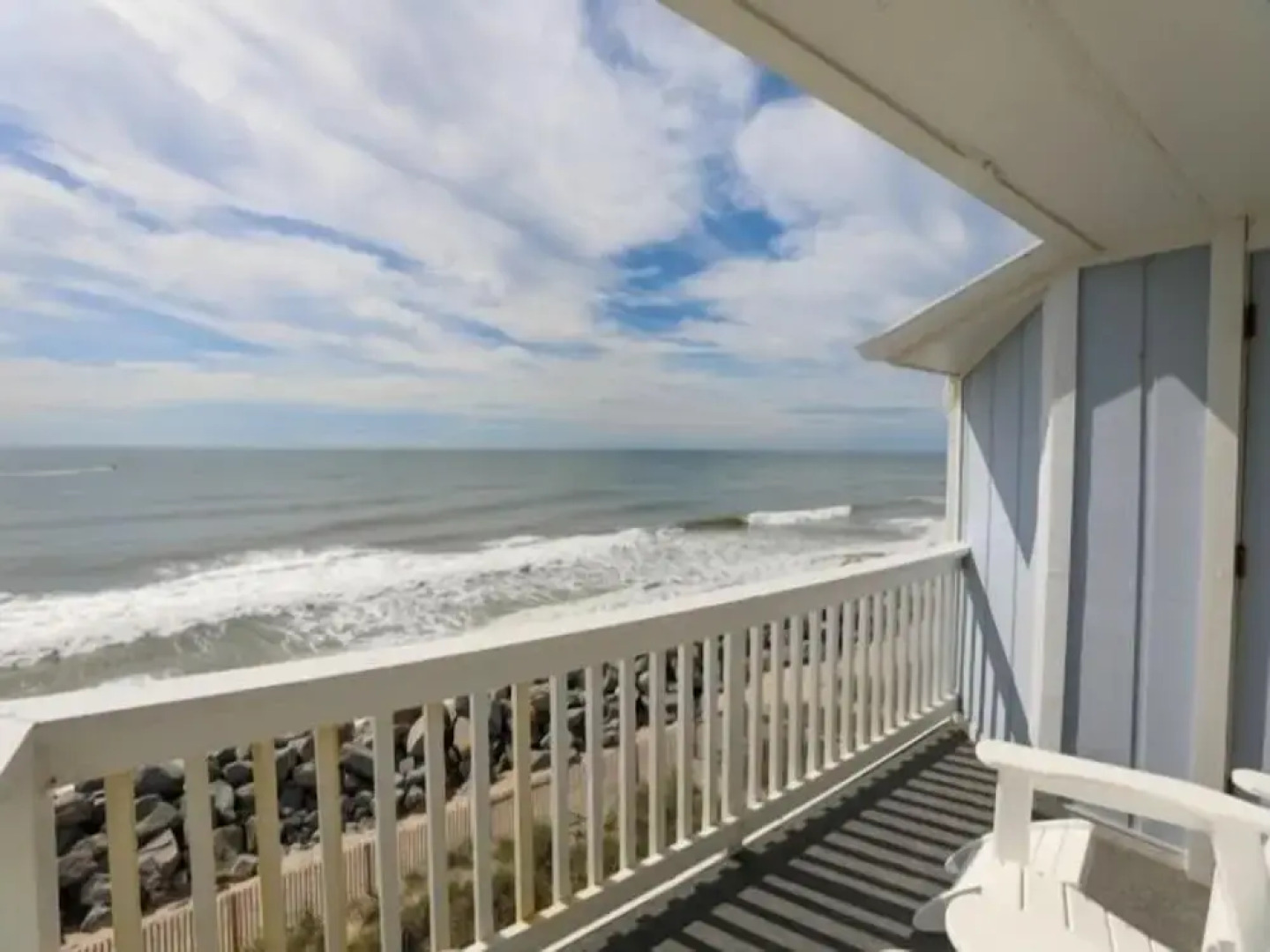 Beach Sunrise - Relaxing and Romantic! Enjoy ocean views from the bedroom with balcony access. 1 Condo by RedAwning