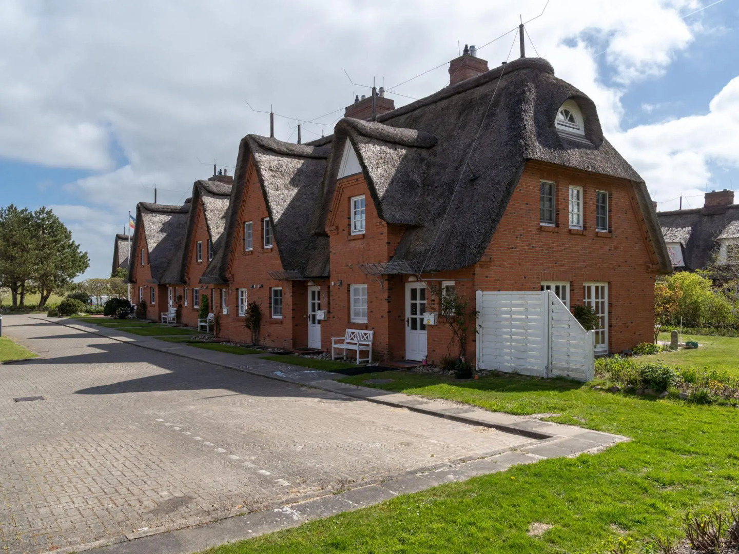 Holiday apartment with a fireplace in a thatched apartment house