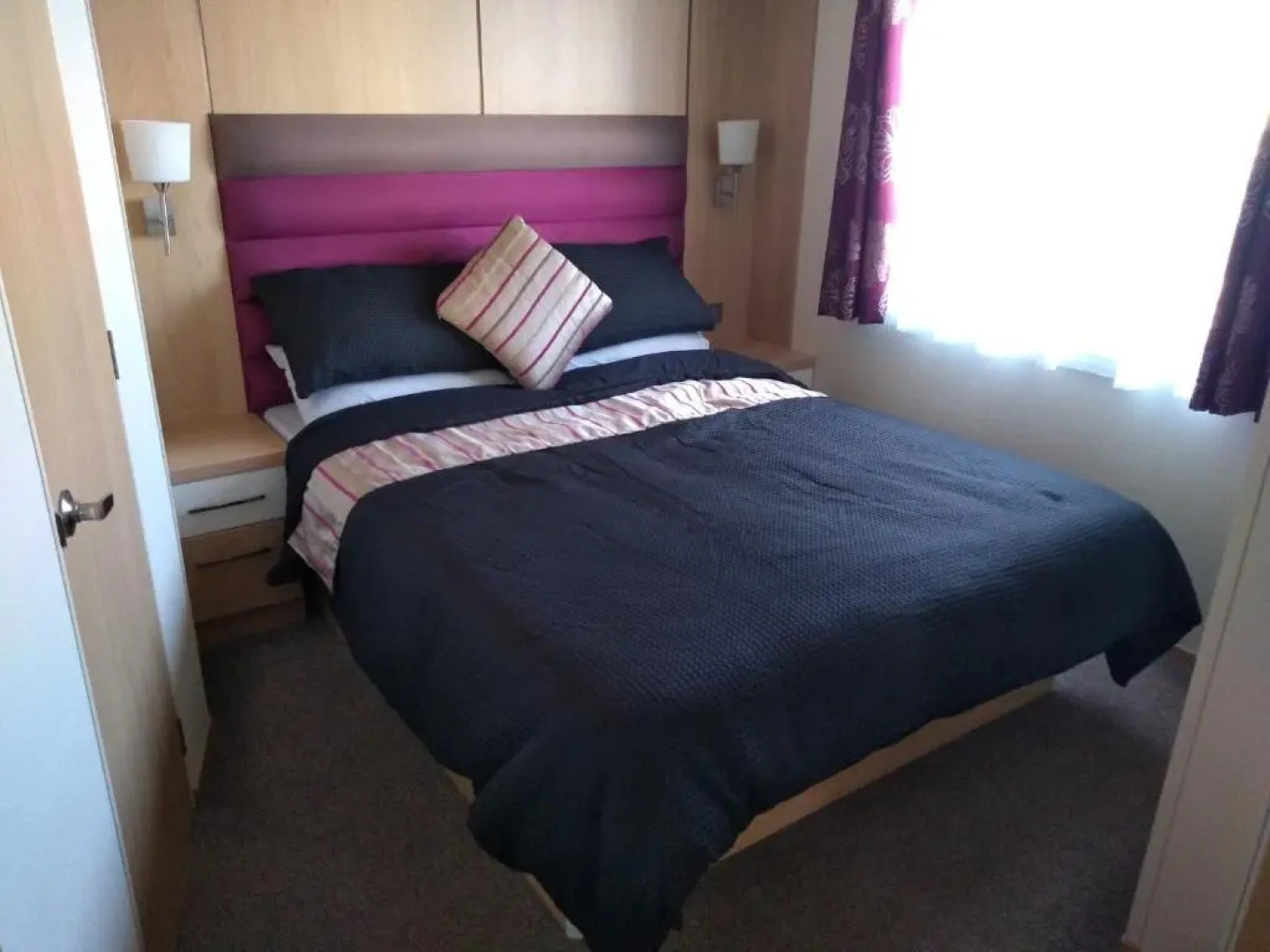 E3 is a 2 Bedroom 6 berth Lodge on Whitehouse Leisure Park in Towyn near Rhyl with Free WiFi, decking and private parking space