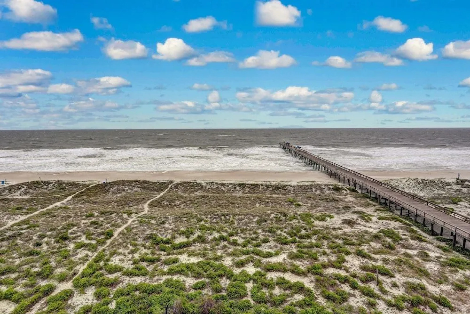 North End Corner Unit with View of the Ocean and Miles of Sandy Beach by RedAwning