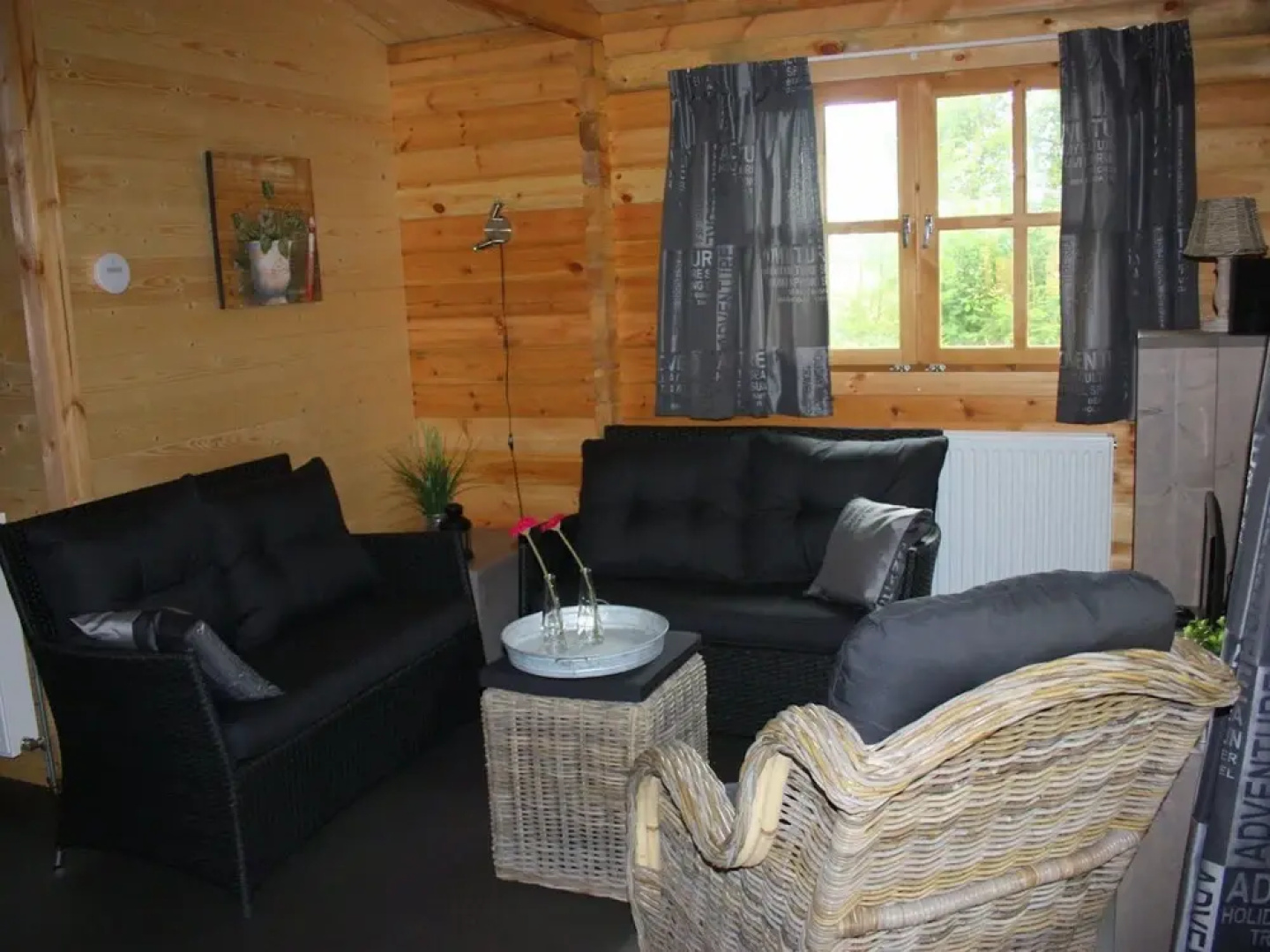 Wooden Cottage With a Veranda Located in a Natural Area