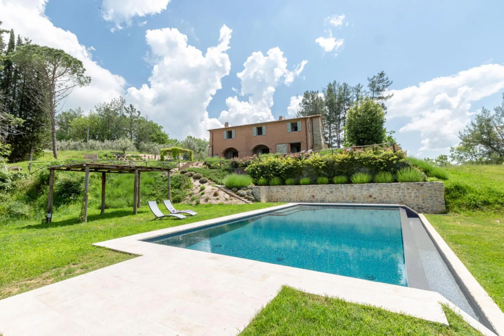 In an enchanting position, located on a hill, Podere Calcina is a recently completely renovated farm-Podere Calcina