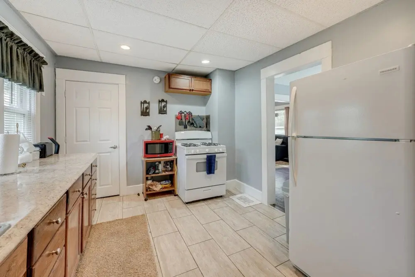 Centrally Located Albion Home With Screened Porch!