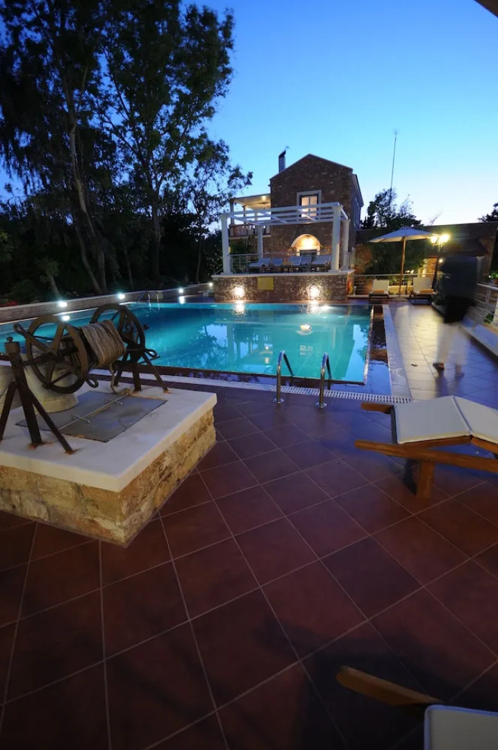 Dine on the Generous Veranda at a Rustic Stone Getaway