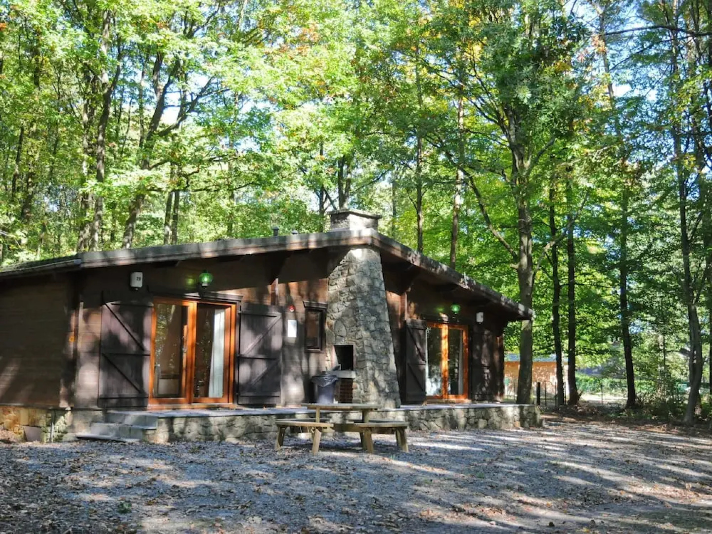 Wooden Chalet With Stove and Microwave Located in the Forest