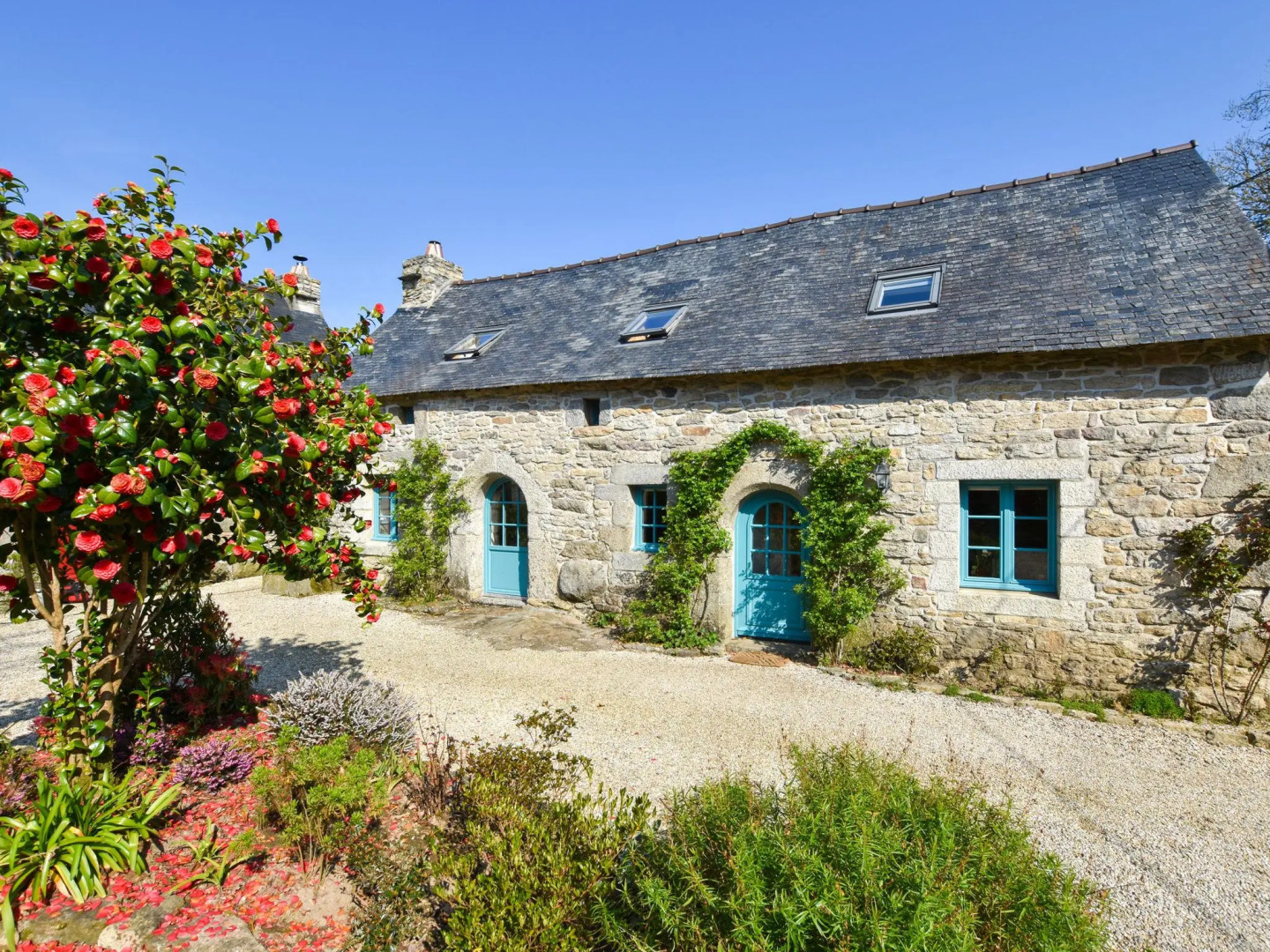 17th century Breton cottage with modern interior on the edge of a forest.