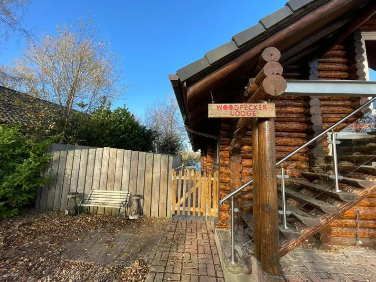 Woodpecker Log Cabin with hot tub, pizza oven bbq entertainment area, lakeside with private fishing peg situated at Tattershall Lakes