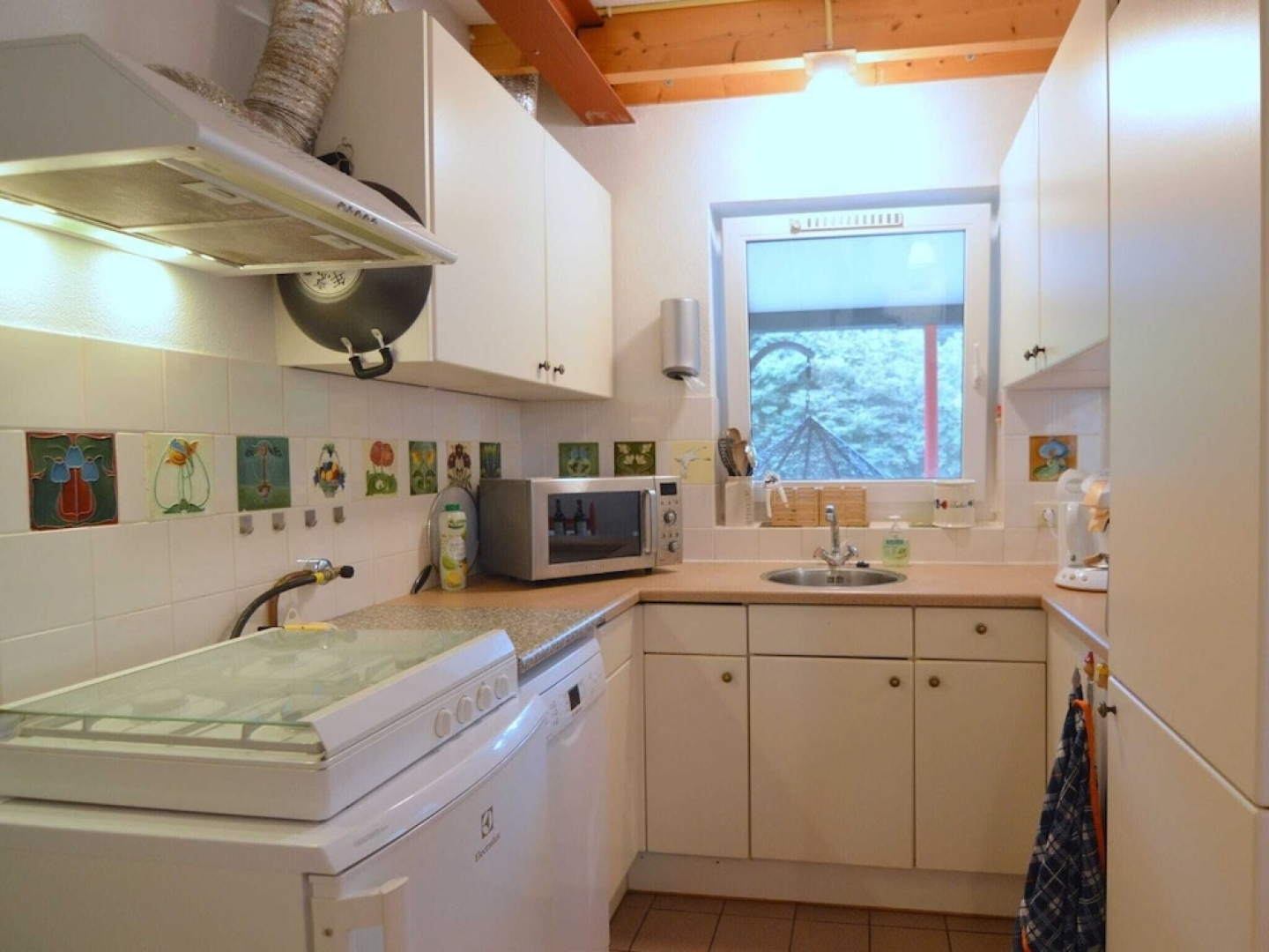 Detached house with large enclosed garden, playground equipment and covered terrace