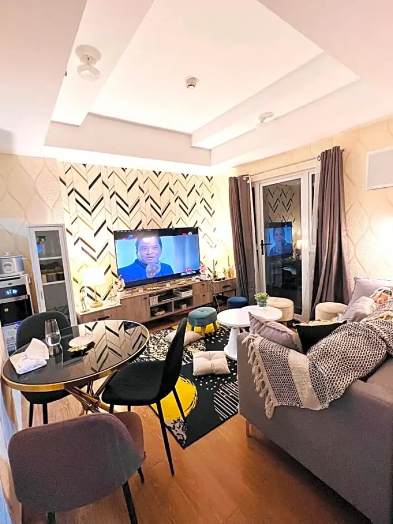 New Cozy 2 bedroom unit condotel for staycation with living room and kitchen set with pool