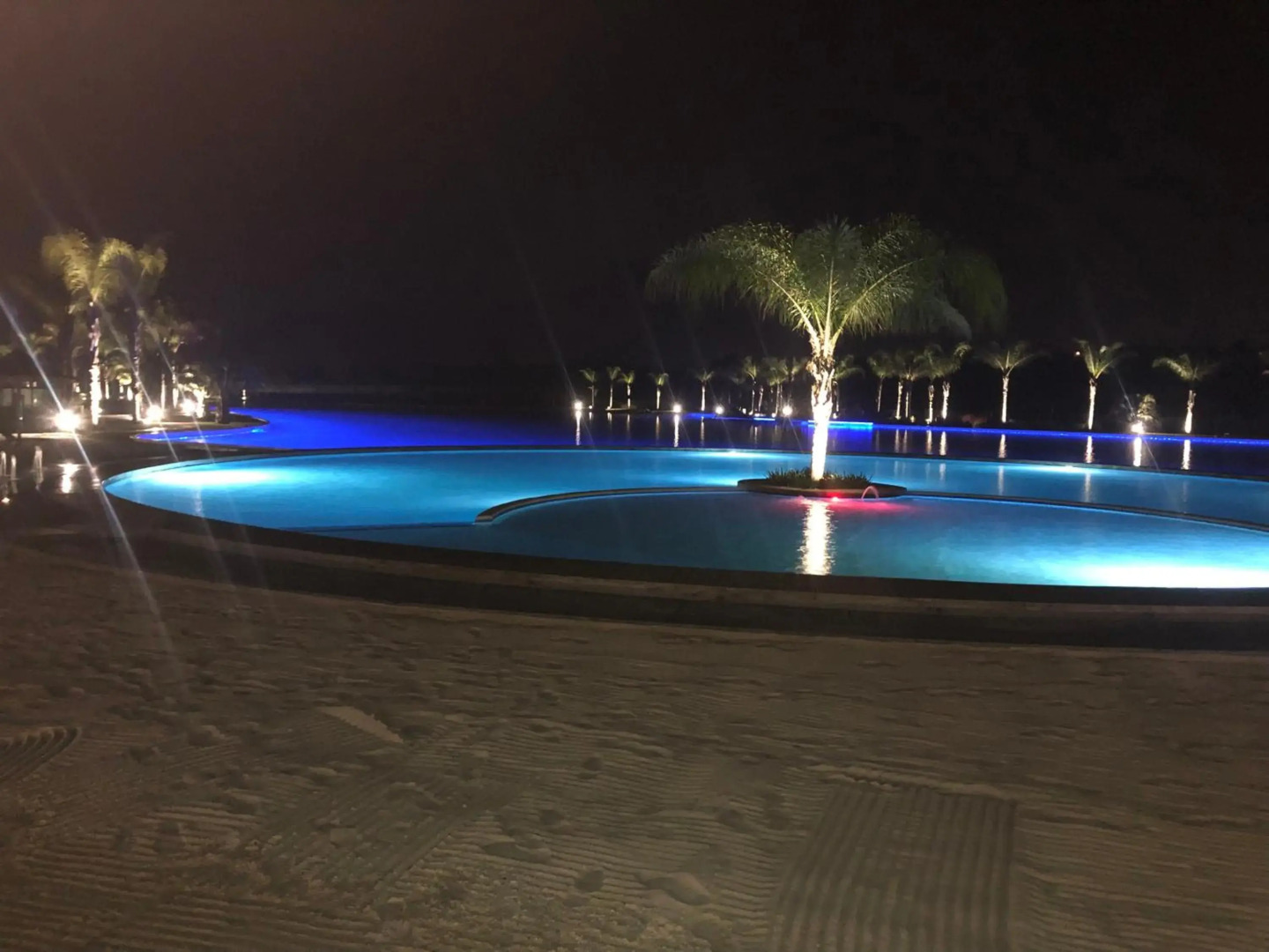 A Coastal/island experience at a Large 2 bed apartment at a Crystal Lagoon Estate.