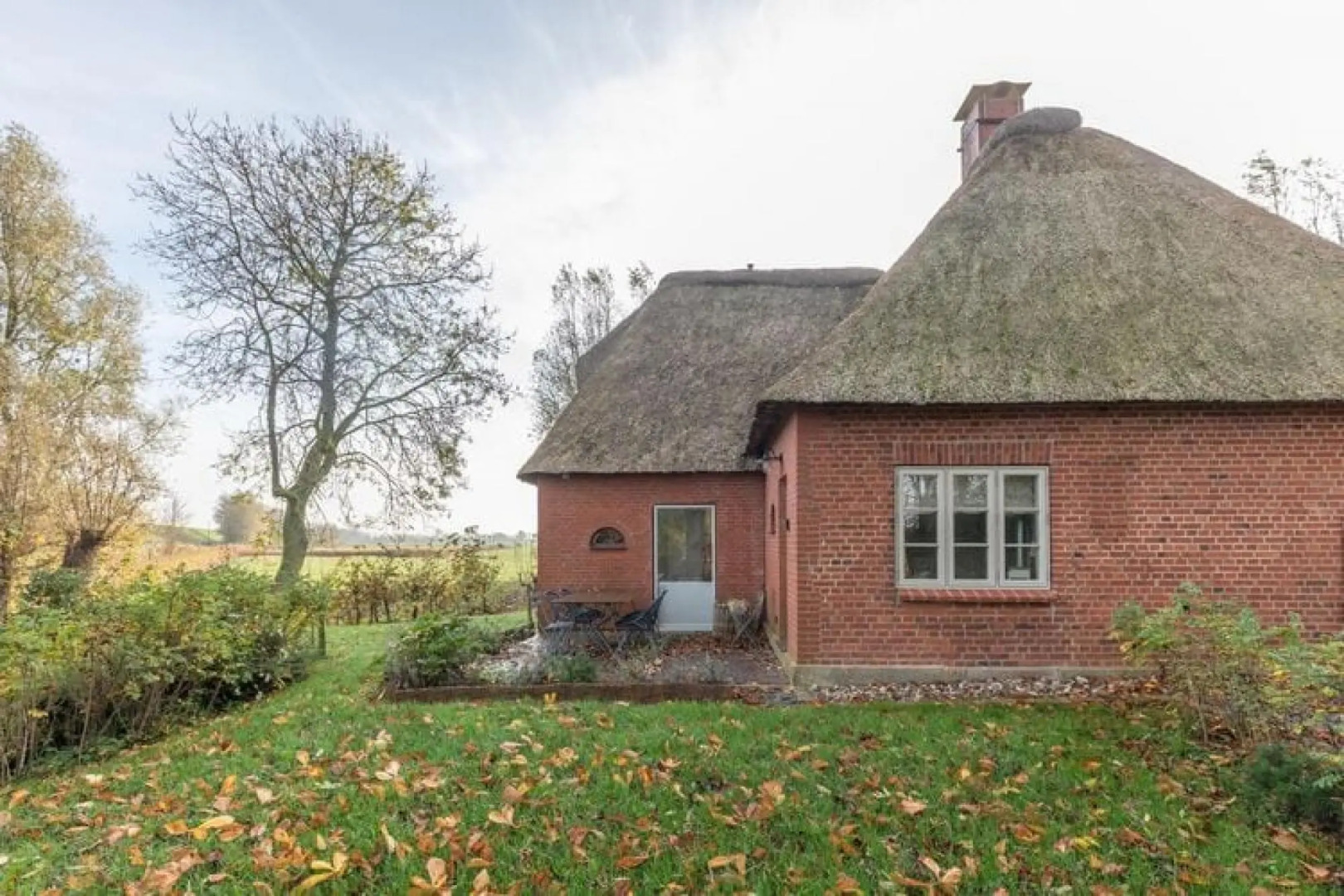 thatched cottage with tiled stove