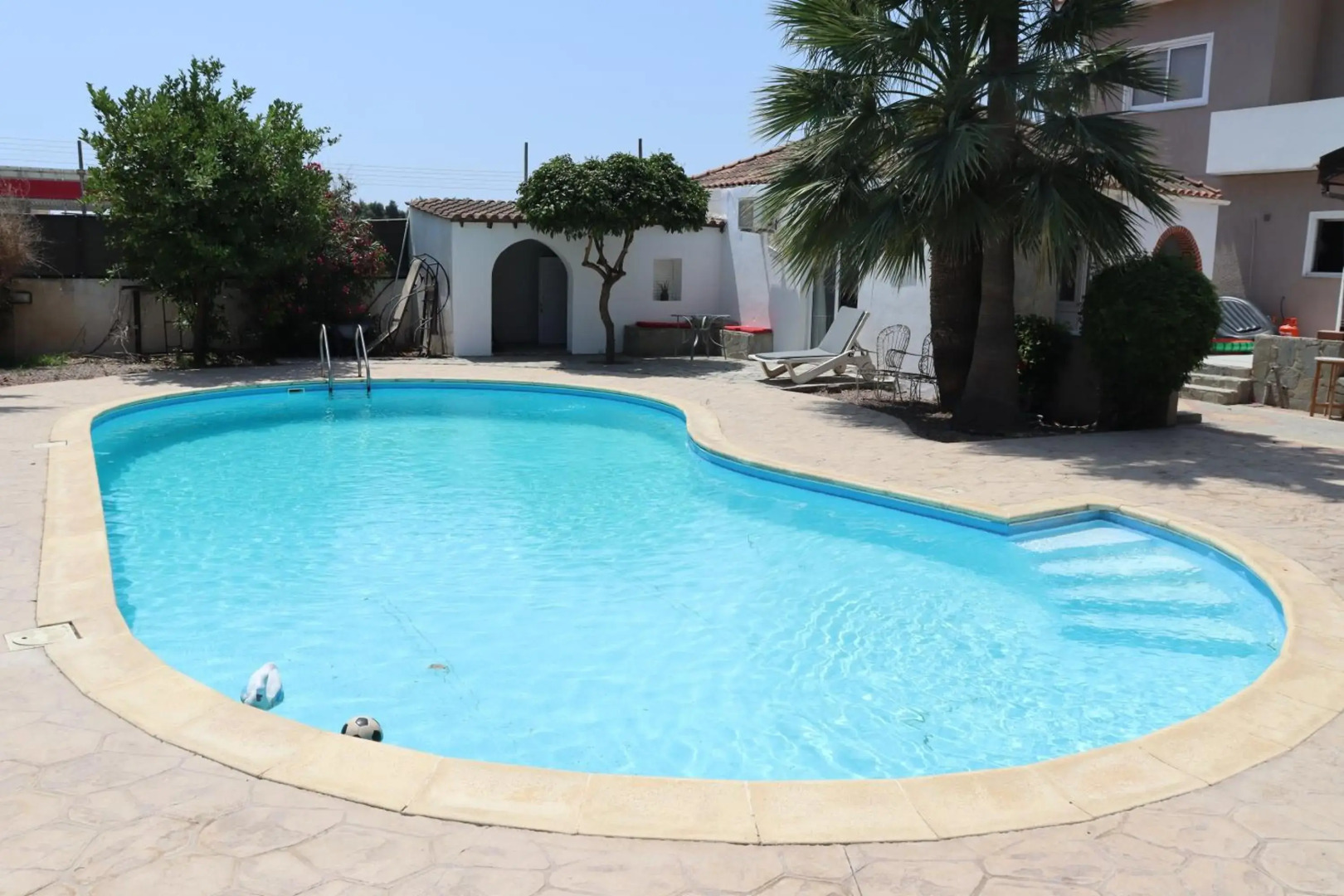 Mediterranean poolside garden cottage