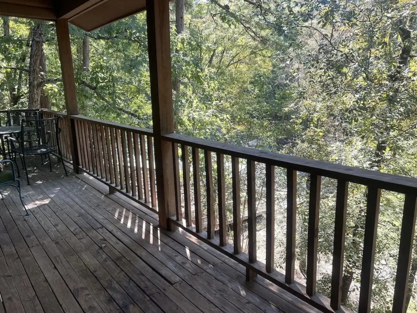 Forest view, log-sided two bedroom, two bath condo on Lake Ouachita. by RedAwning