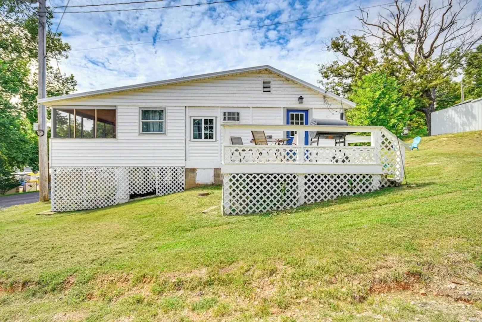 Cozy Cottage w/ Deck: Walk to Lake of the Ozarks!