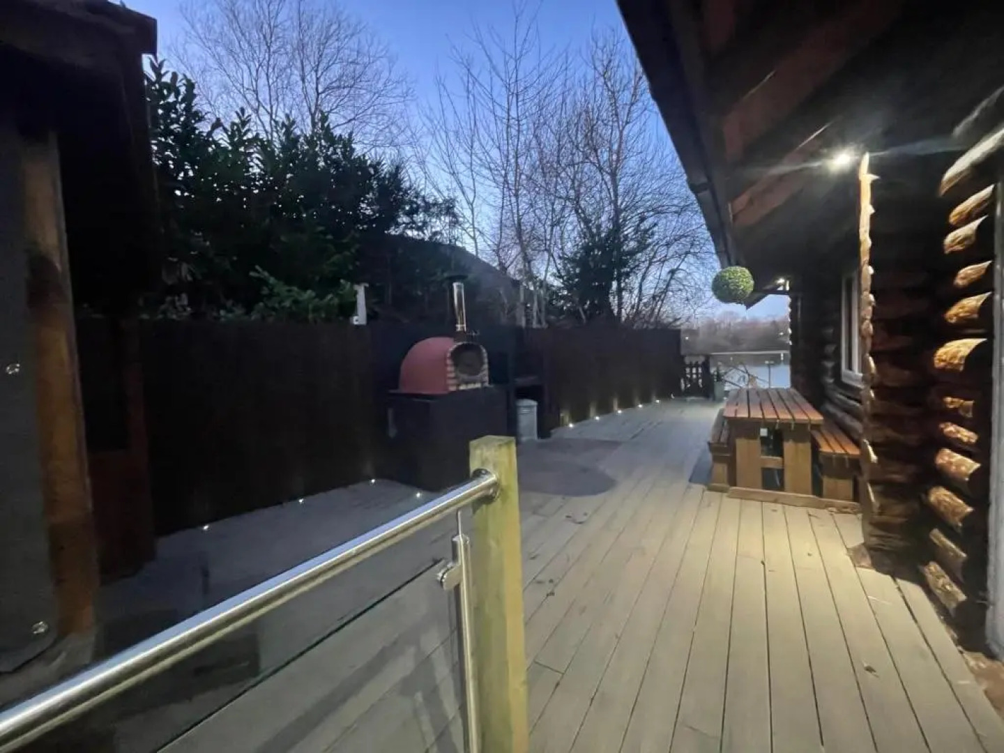 Woodpecker Log Cabin with hot tub, pizza oven bbq entertainment area, lakeside with private fishing peg situated at Tattershall Lakes