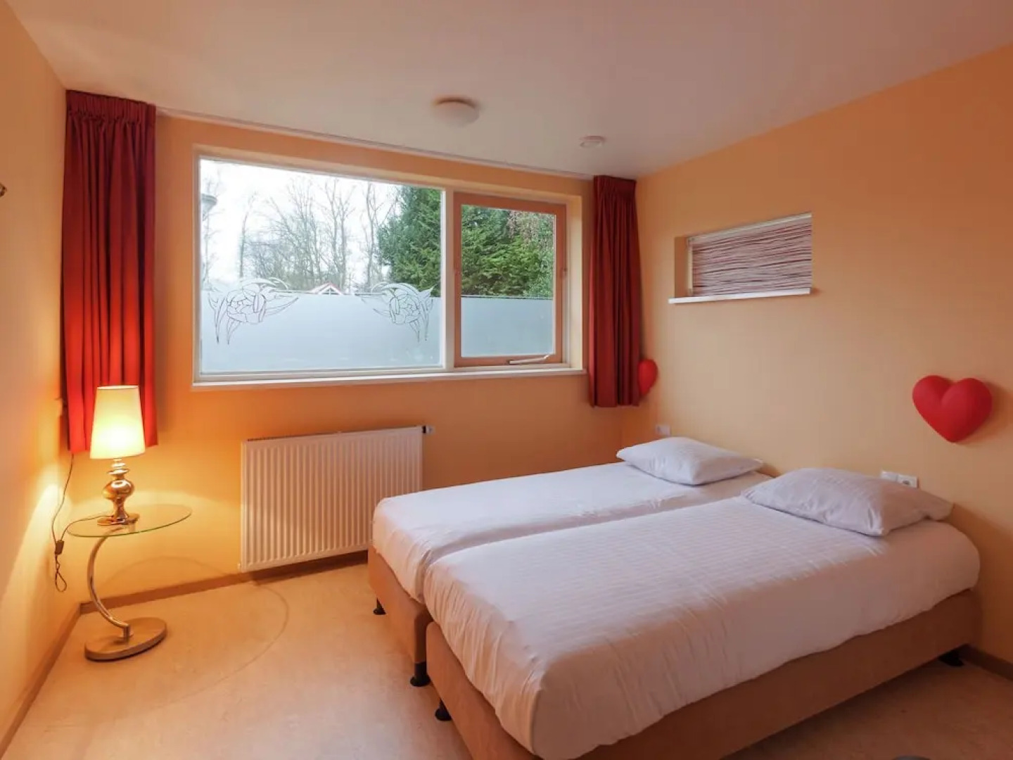 Cozy decorated house with fireplace, surrounded by forest