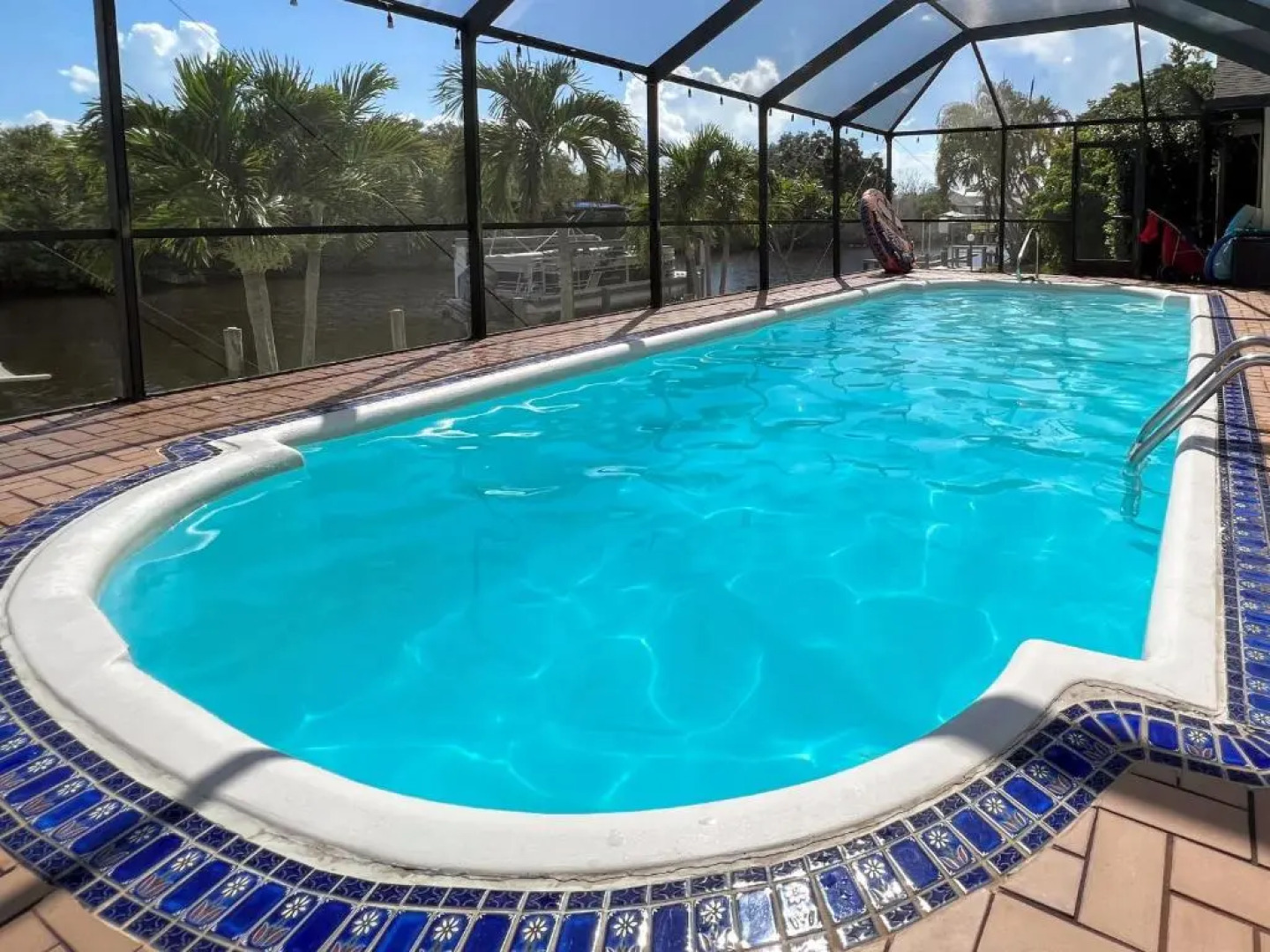 Waterfront House with a Boat and Heated Pool