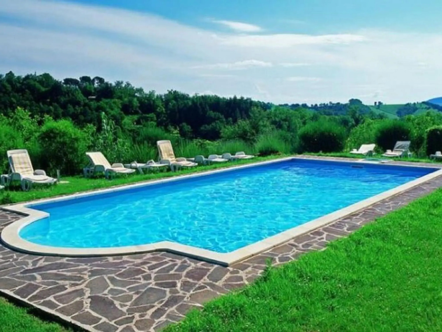 A holiday home with swimming pool in a national park