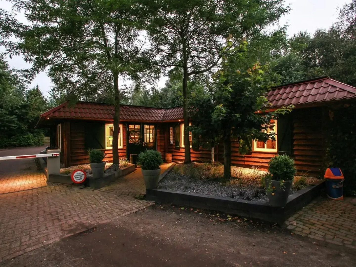 Wooden Cottage With a Veranda Located in a Natural Area