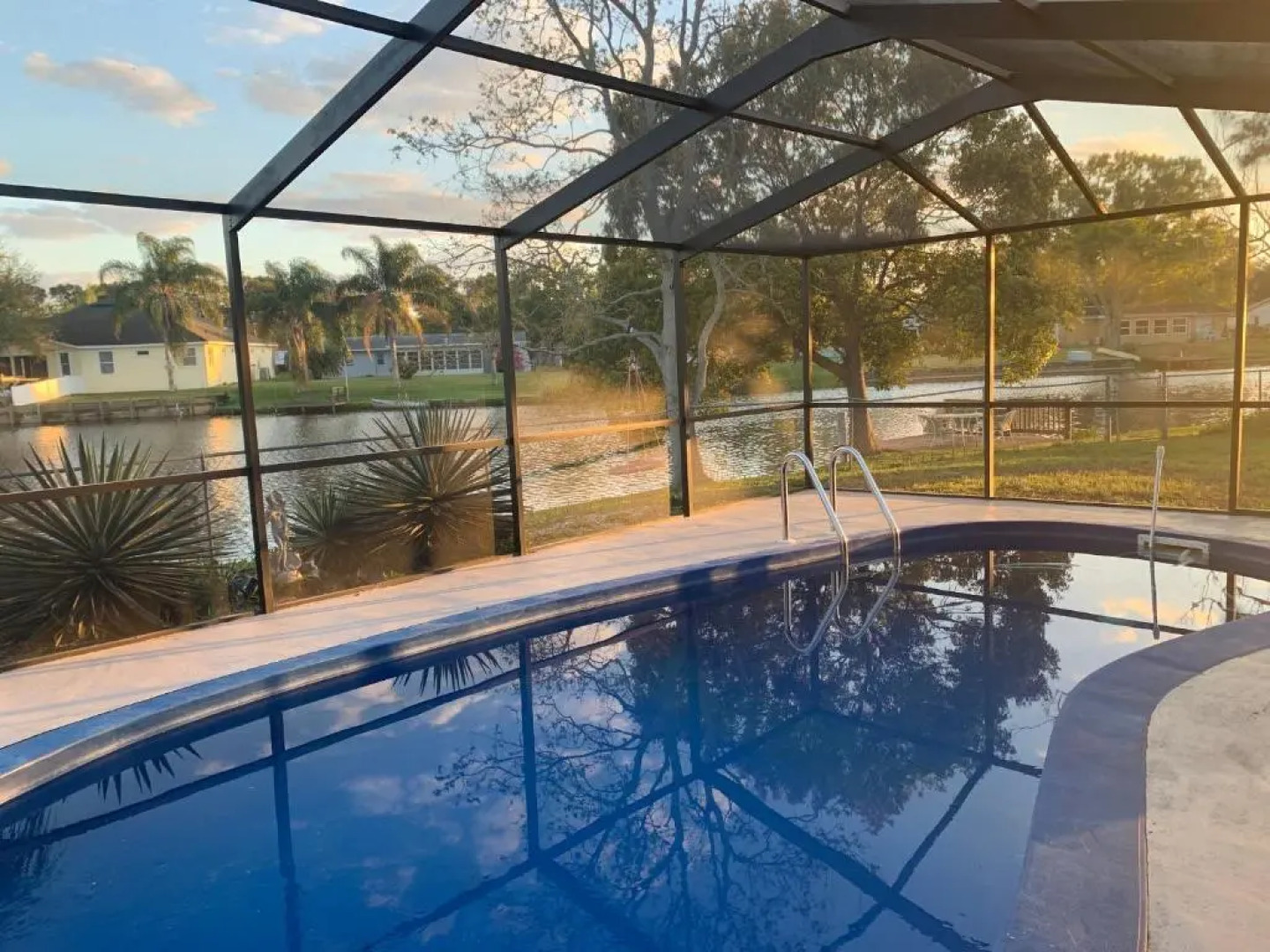 Private Tropical Waterfront Sanctuary with pool, hot tub & an island!