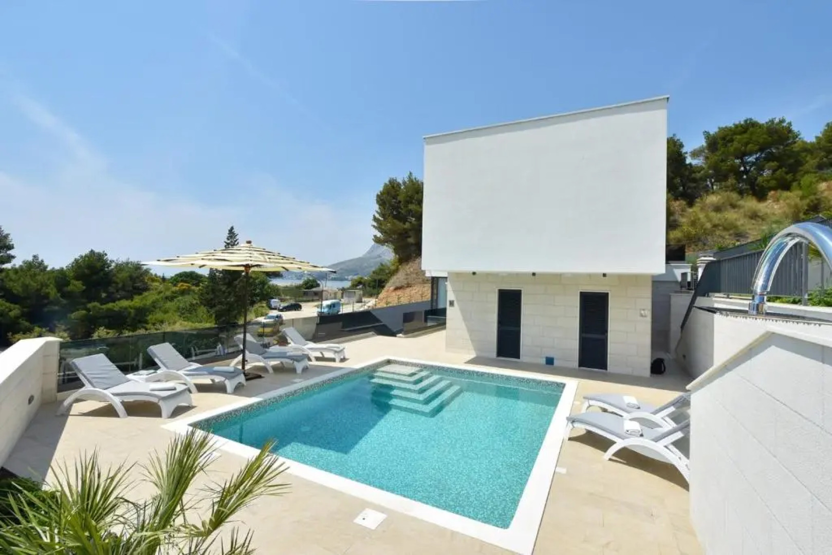 Luxury, seafront Villa Petra with heated pool only 50m from beach