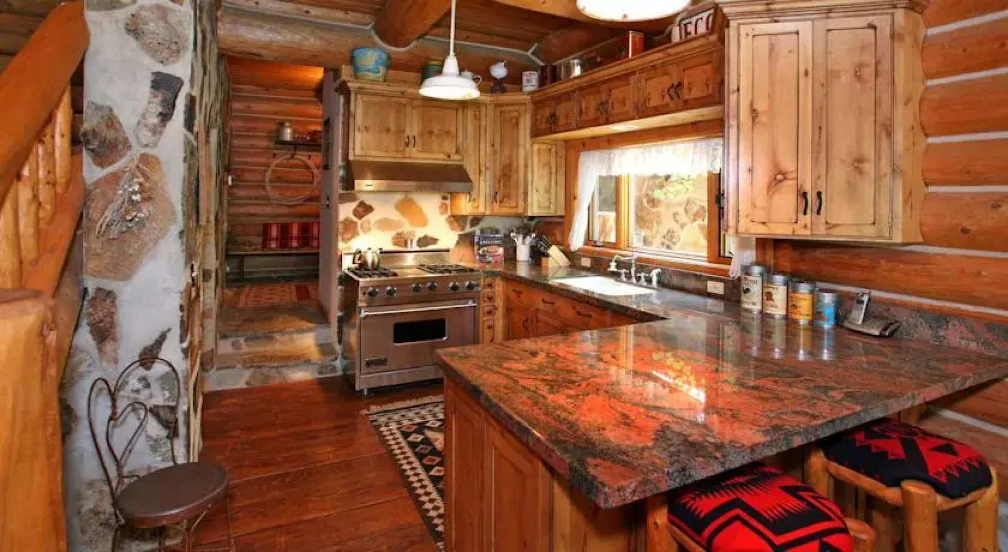 Red Roof On The River by Stewart Mountain Lodging