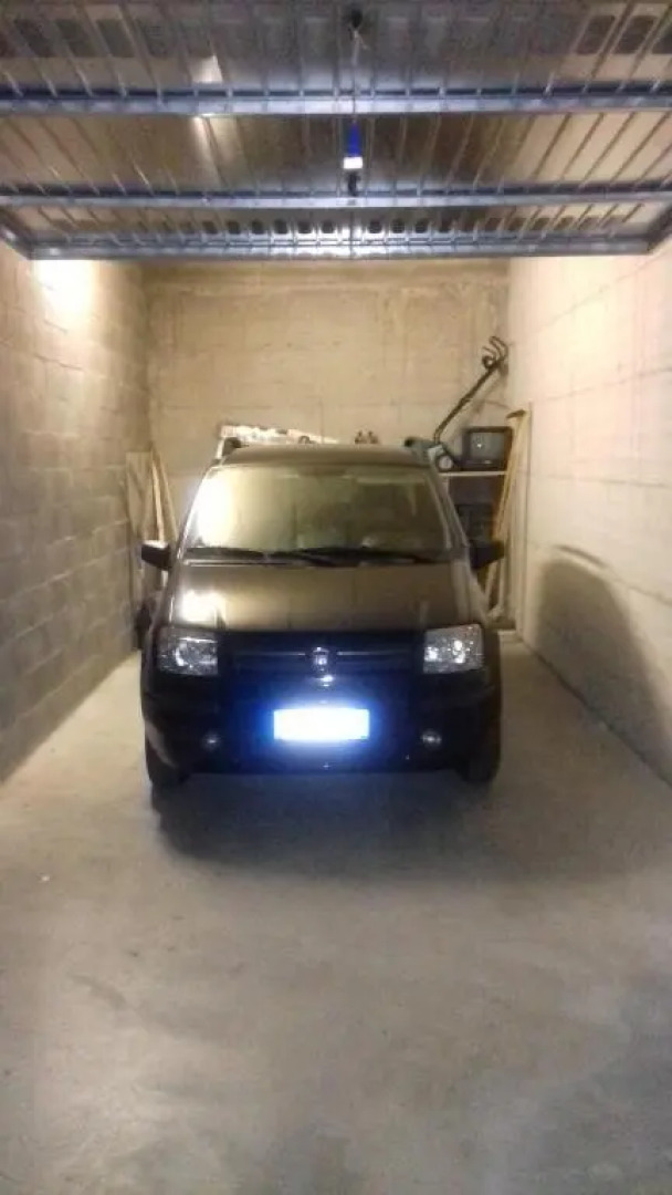 bilocale con giardino e box