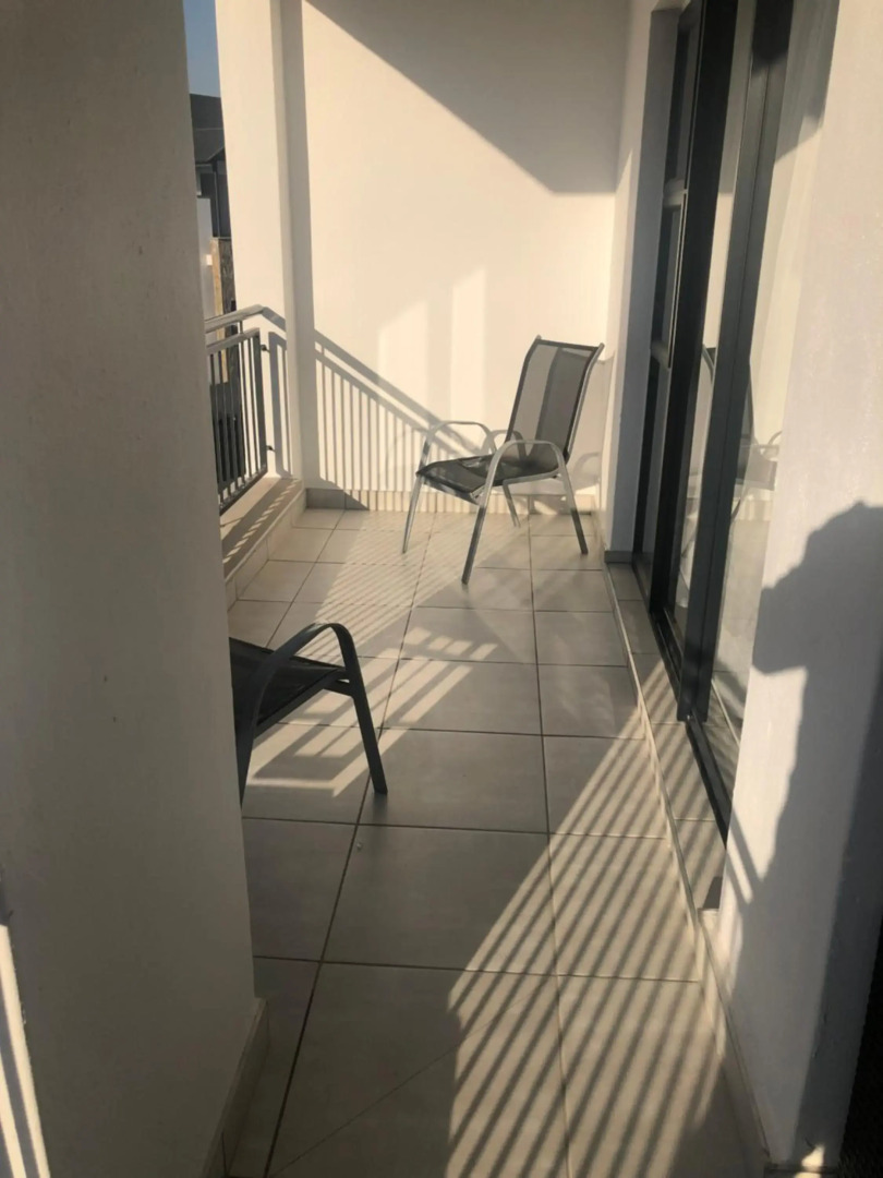 A Coastal/island experience at a Large 2 bed apartment at a Crystal Lagoon Estate.