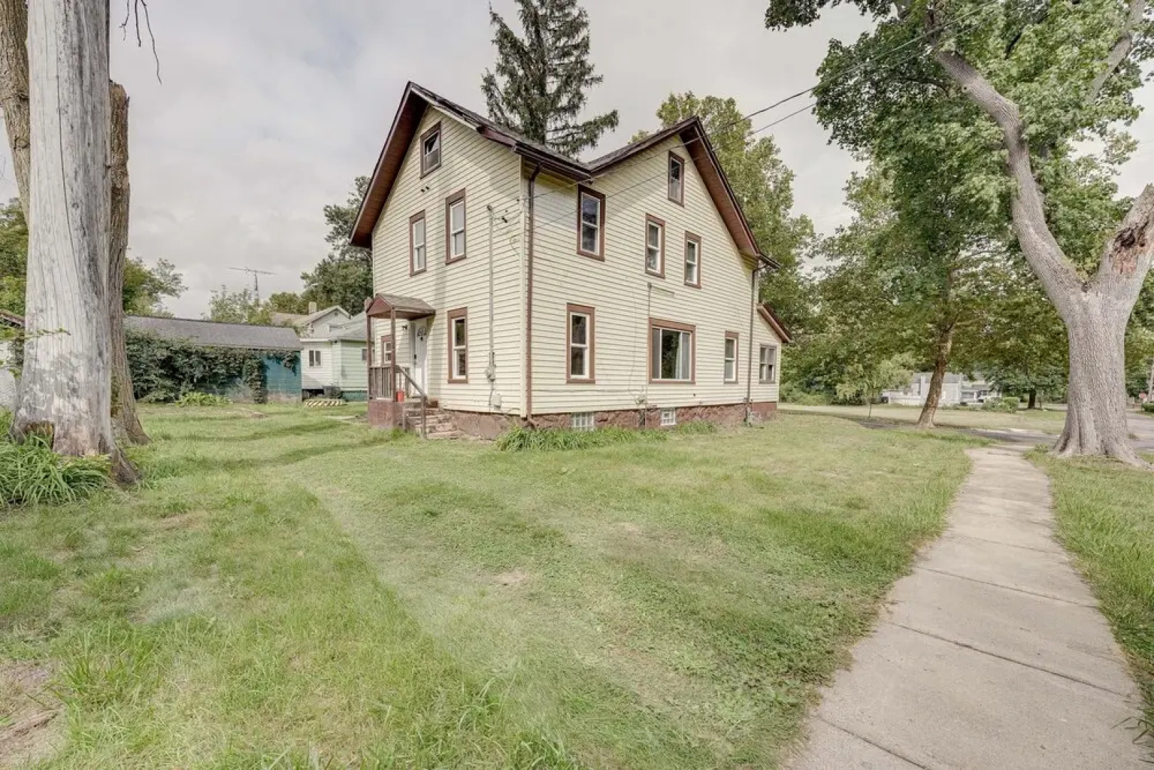 Centrally Located Albion Home With Screened Porch!