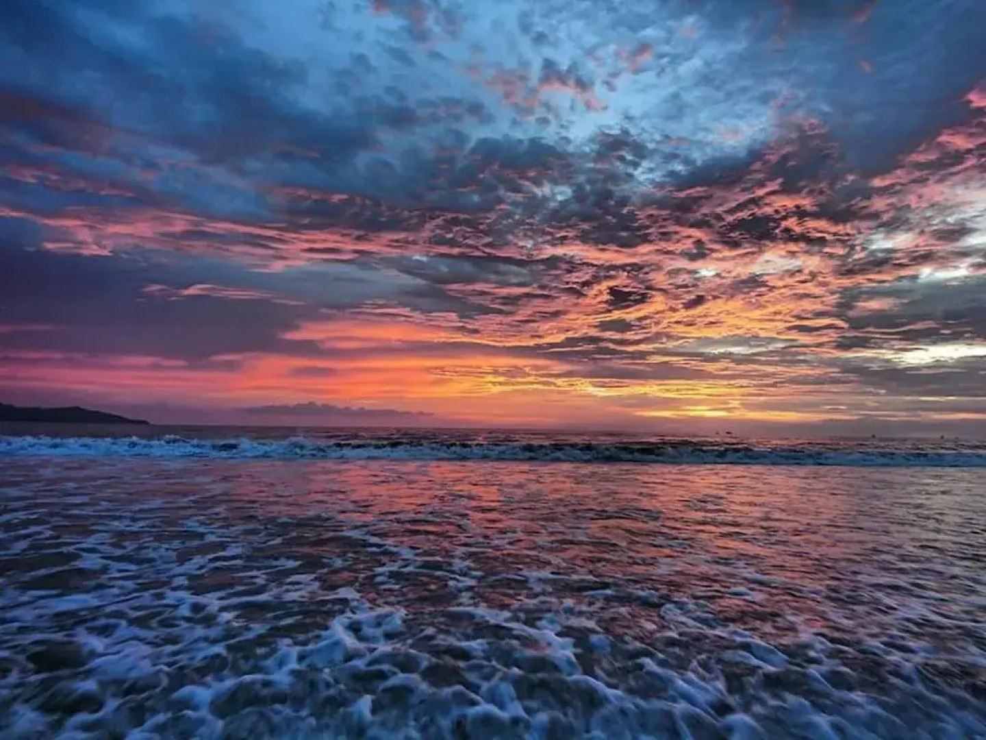 Stylish Split-Level Condo with a Shaded Terrace, Direct Beach Access, and Resort-Style Community Amenities