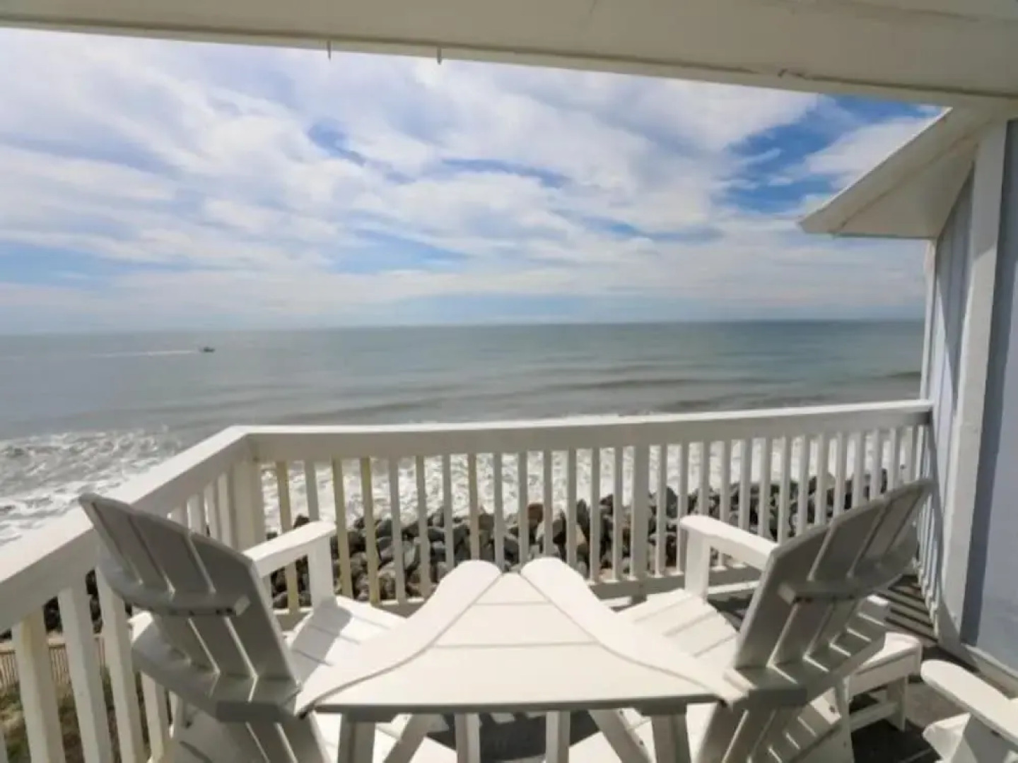 Beach Sunrise - Relaxing and Romantic! Enjoy ocean views from the bedroom with balcony access. 1 Condo by RedAwning