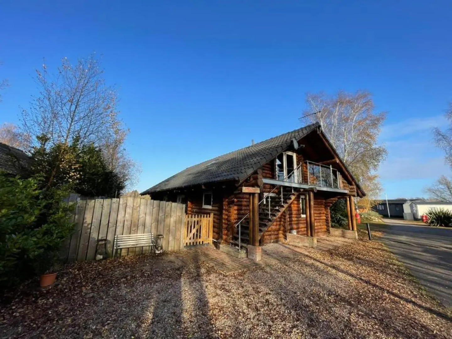 Woodpecker Log Cabin with hot tub, pizza oven bbq entertainment area, lakeside with private fishing peg situated at Tattershall Lakes