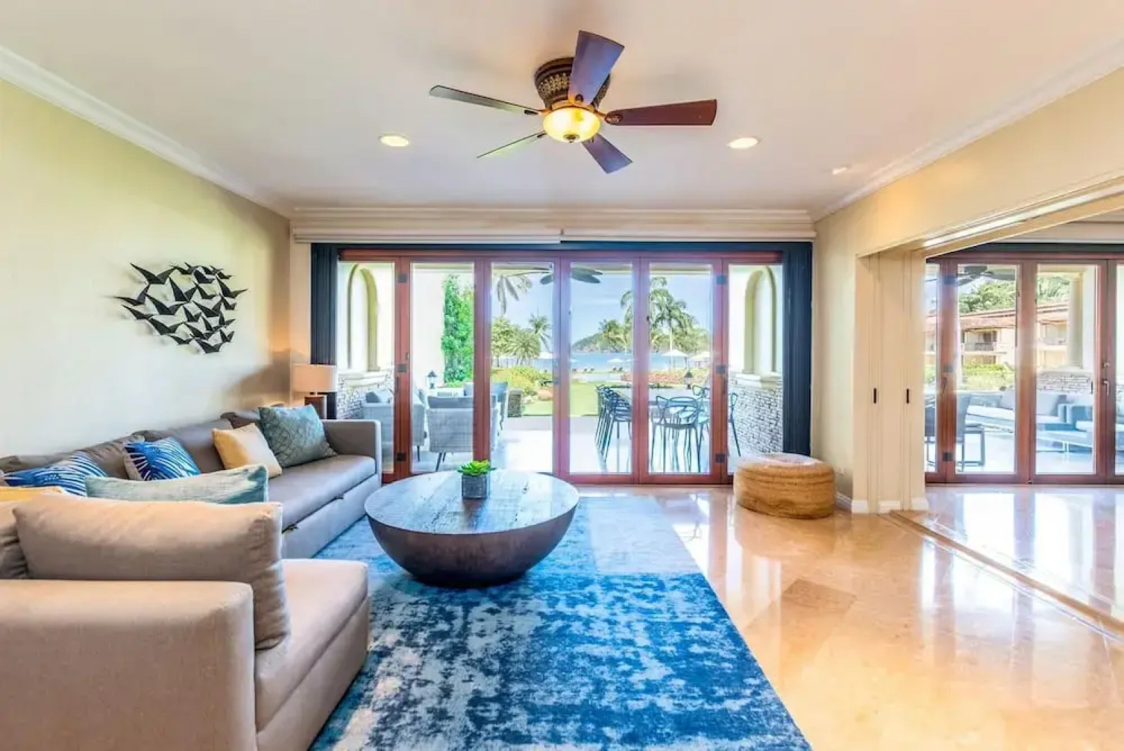 Stylish Split-Level Condo with a Shaded Terrace, Direct Beach Access, and Resort-Style Community Amenities