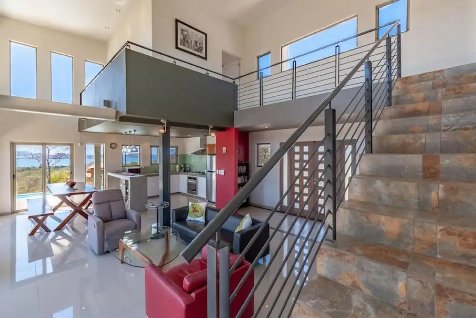 Modern Hillside Home with Sleek Interiors and Panoramic Poolside Views